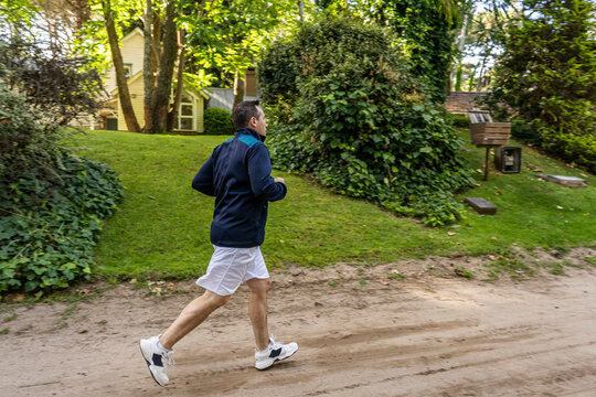 Male athlete walking after running outdoors