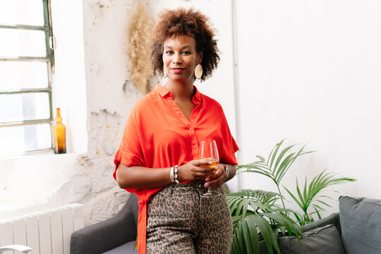 Portrait Of A Woman Holding A Glass Of Wine