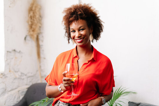 Portrait Of A Woman Holding A Glass Of Wine