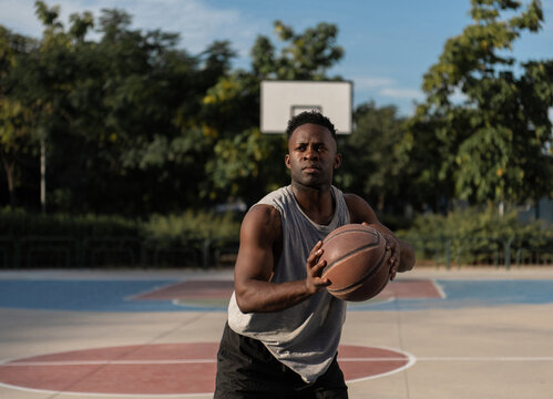 Black basketball player ready to throw ball