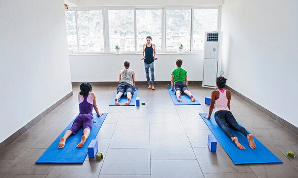 yoga teacher instructing group in Yangshuo