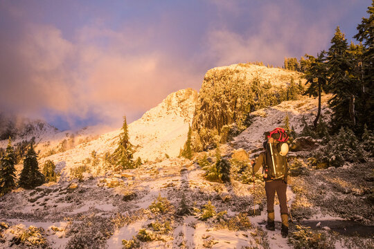Rear view of hiker backpacking in Pinecone Burke Provincial Park.