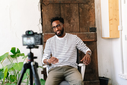 A Black man recording in a video interview