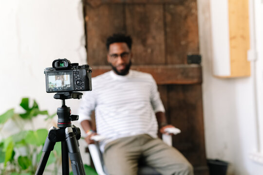 A Black man recording in a video interview