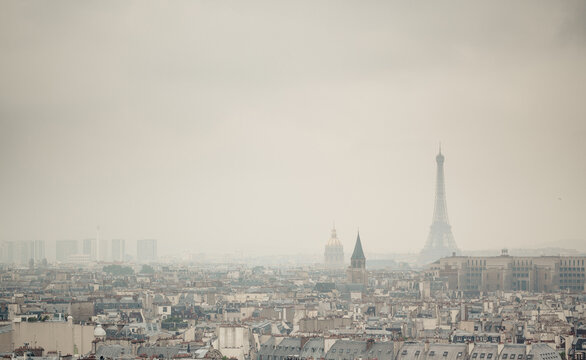 Cityscape and Eiffel Tower on a foggy day