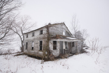 Abandoned Farmhouse in Foggy Canadian Winter