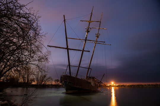 A Shipwreck on A Frozen Lake Ontario at Night