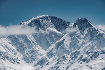 Idyllic shot of snowcapped mountain against blue sky