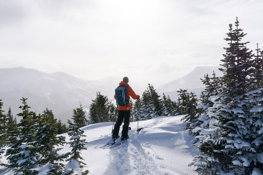 Rear view of woman splitboarding during vacation