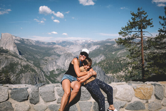 Mom hugs son on family Vacation in Yosemite