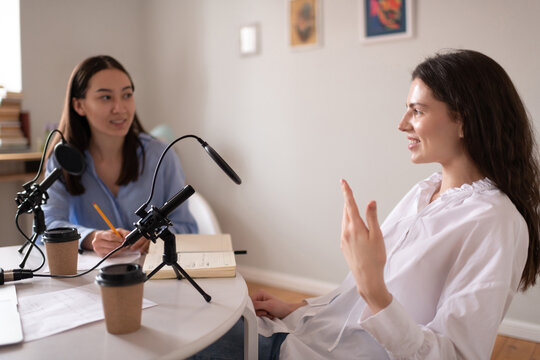 Diverse women talking during podcast