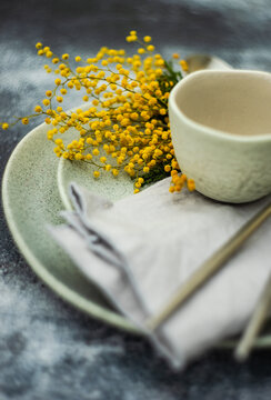 Spring mimosa flowers used in table setting decoration