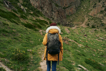 Fototapeta na wymiar woman hiker with backpack mountains travel adventure freedom