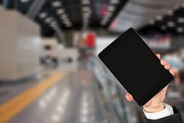 Covid pass certificate at airport. Digital gadget with a blank screen