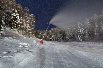Ski slopes at night under the stars in the sky