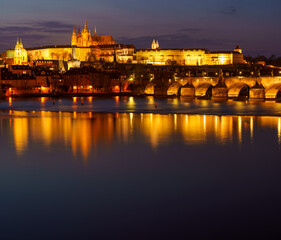 Fototapeta na wymiar night view of prague castle and st. vitus and cathedral bridge on ece vltava at night in the center of prague
