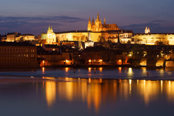 Naklejka na ściany i meble night view of prague castle and st. vitus and cathedral bridge on ece vltava at night in the center of prague