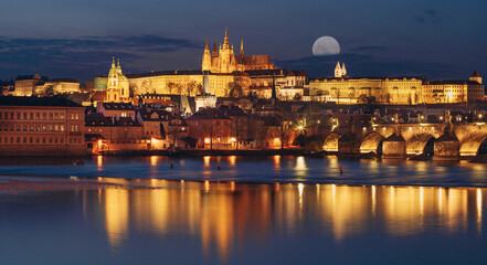 Panorama night view of prague castle and st. vitus and cathedral bridge on ece vltava at night in...