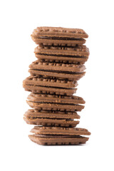 chocolate cookies and cream, stacked layer biscuits isolated on white background, closeup side view