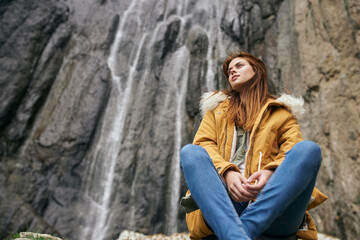 woman yellow jacket tourism mountains adventure landscape