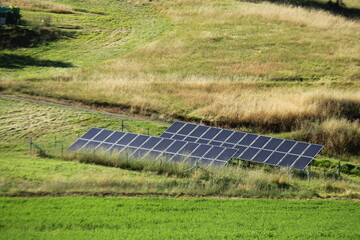 Sustainable living, solar panels supplying power for off grid living.	
