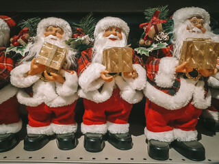 Santa Claus toy on shelf in store Concept Happy New Year Holiday card, poster Christmas market concept