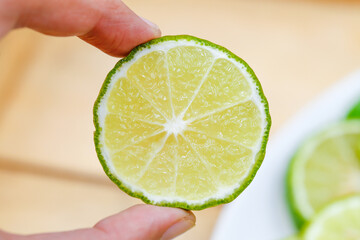 a piece of sliced bergamot on hand