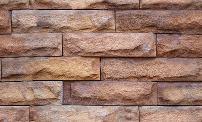 Brown brick background. Stone seamless pattern