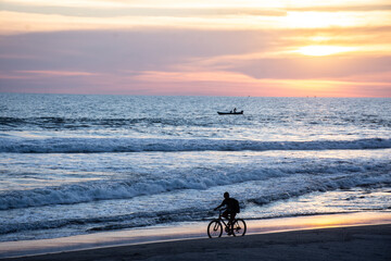 Ridding bike on the beach
