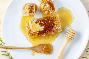 Sweet Honeycomb on wooden background, Yellow Honeycomb in white plate on wooden background, 