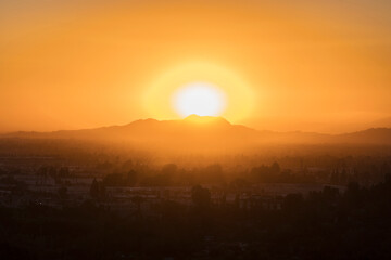 Sunrise behind Mt Hollywood and Mt Lee at the east end of the Santa Monica Mountains in the...