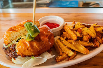 Close up shot of onion burger with french fries