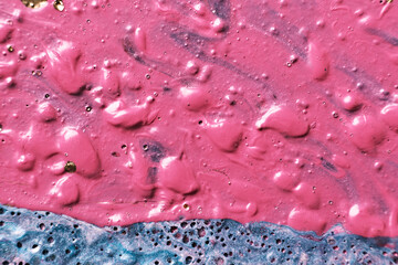 Fluid Art. Bubble paint abstraction. Tactile bumpy pink paint background or texture close-up