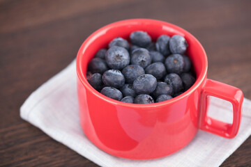 Blueberry fruit in red cup