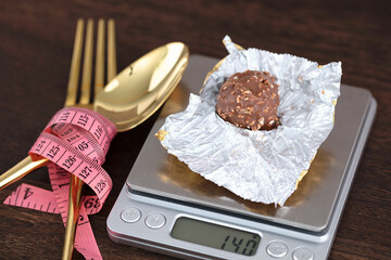 Chocolate on a small scale and tangled tableware