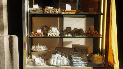 Showcase with desserts for sale in pastry shop.