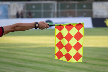 Soccer referee hold the flag. Offside trap