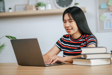 A young woman working with a laptop