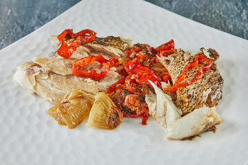 Fish locus stuffed with bell pepper. French gourmet cuisine
