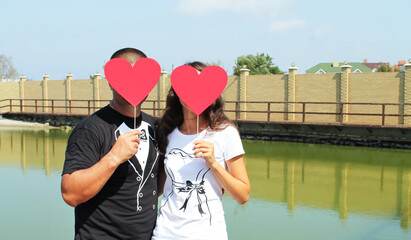 Couple with red heart instead of head emoji concept