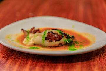 Obraz premium Spanish pintxos of grilled squid stuffed with crabmeat in San Sebastian, Spain