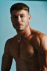 Fototapeta premium male with bulging topless muscle workout posing bodybuilder