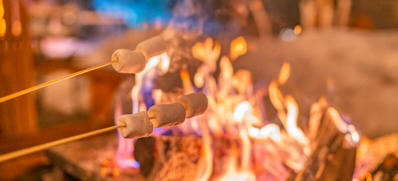 Campfire Marshmallow Fire Roasting Over Firepit At Outdoor Camp Banner Panoramic. Family Making Smores With Melting Marshmallows.