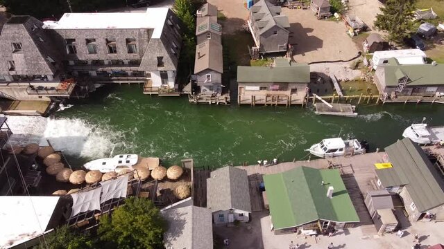 Aerial View Of Small Fishing Town In Michigan - Fish Town, Leland Michigan - drone shot