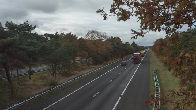 Motion Timelapse Of Vehicles Driving On The Highway During Autumn.