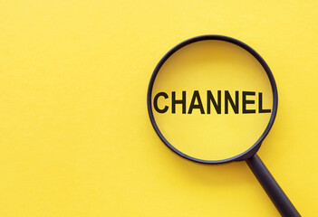 The word CHANNEL is written on a magnifying glass on a yellow background.