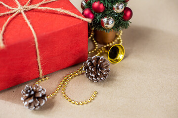 Eco friendly Christmas composition with gift boxes in craft reusable paper and natural decor on paper background top view. Zero waste environmentally friendly Christmas concept. Long banner format.