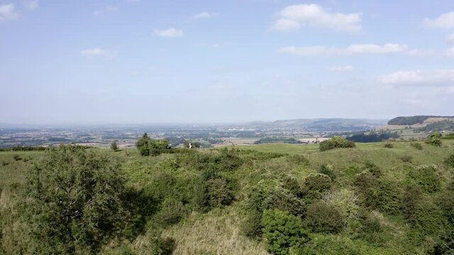 AERIAL -  Green hill on a beautiful day near Uley, Cotswolds, England, circle pan