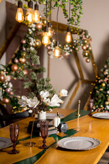Interior view from living room with a Christmas tree to kitchen and set table served for Christmas or New Year