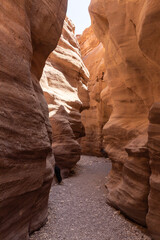Narrow  passage between rocks in a nature reserve near Eilat city - Red Canyon, in southern Israel